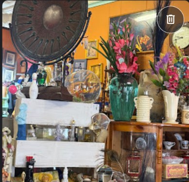 Glassware, flowers, and home décor displayed in the store